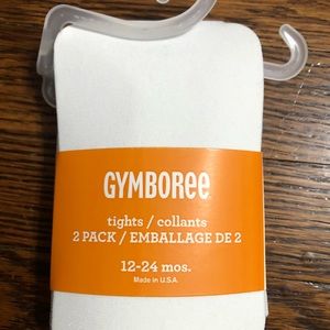 NWT girls’ tights still in packaging. Size 12-24 months.  2 pairs- black & cream